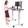 teacher doing work at a stand up desk