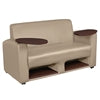 Tan Loveseat Lounge Chair with two small round tables on each side on a white background
