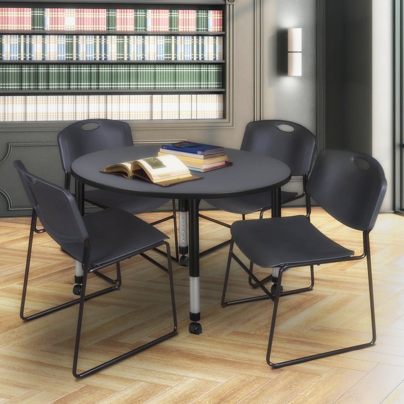 Regency Kee Mobile Round Adjustable Classroom Table with 4 Black Zeng Stack Chairs 48" W x 48" D x 23" - 34"H (REG - TB48RC - 44) - SchoolOutlet