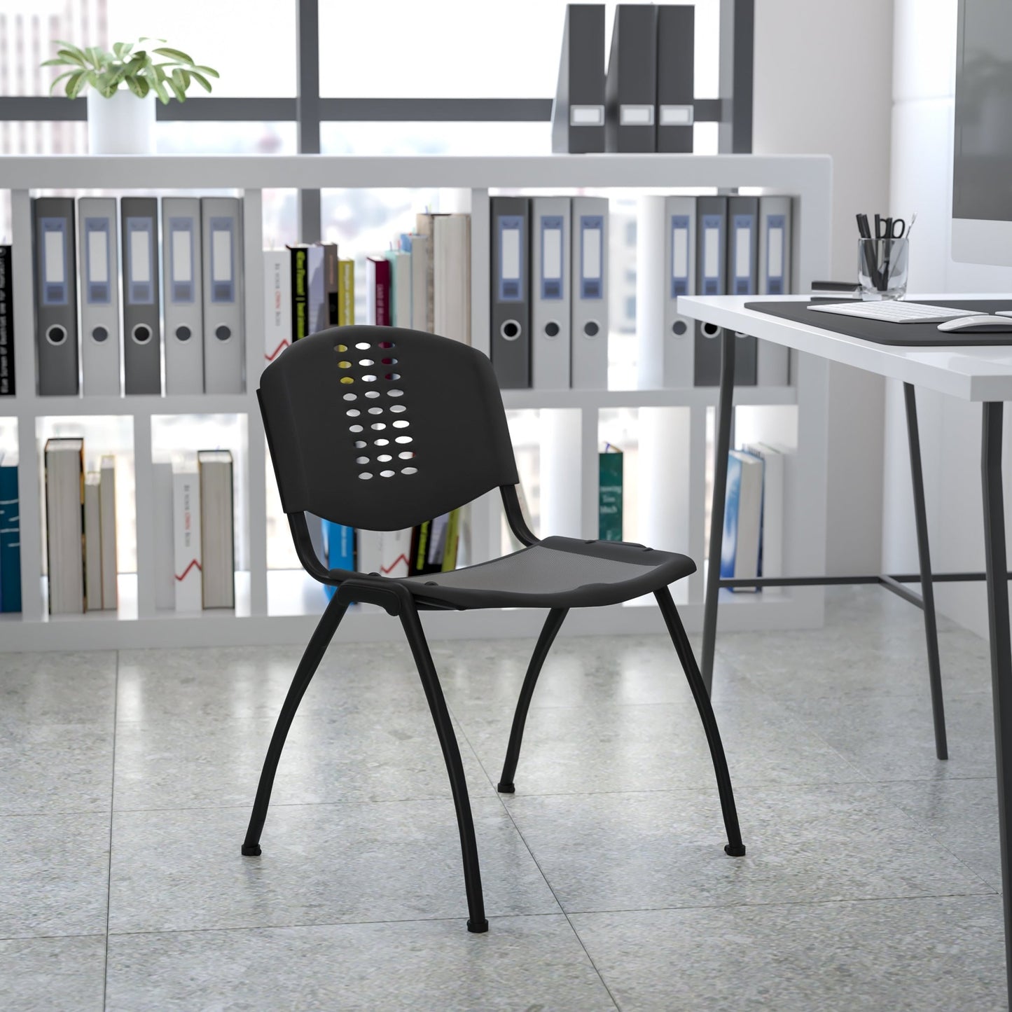 HERCULES Series 880 lb. Capacity Black Plastic Stack Chair with Oval Cutout Back and Black Frame - SchoolOutlet